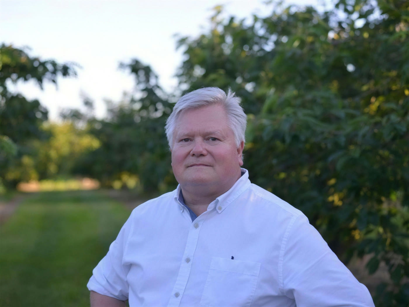 Paul Moyer in the family orchard