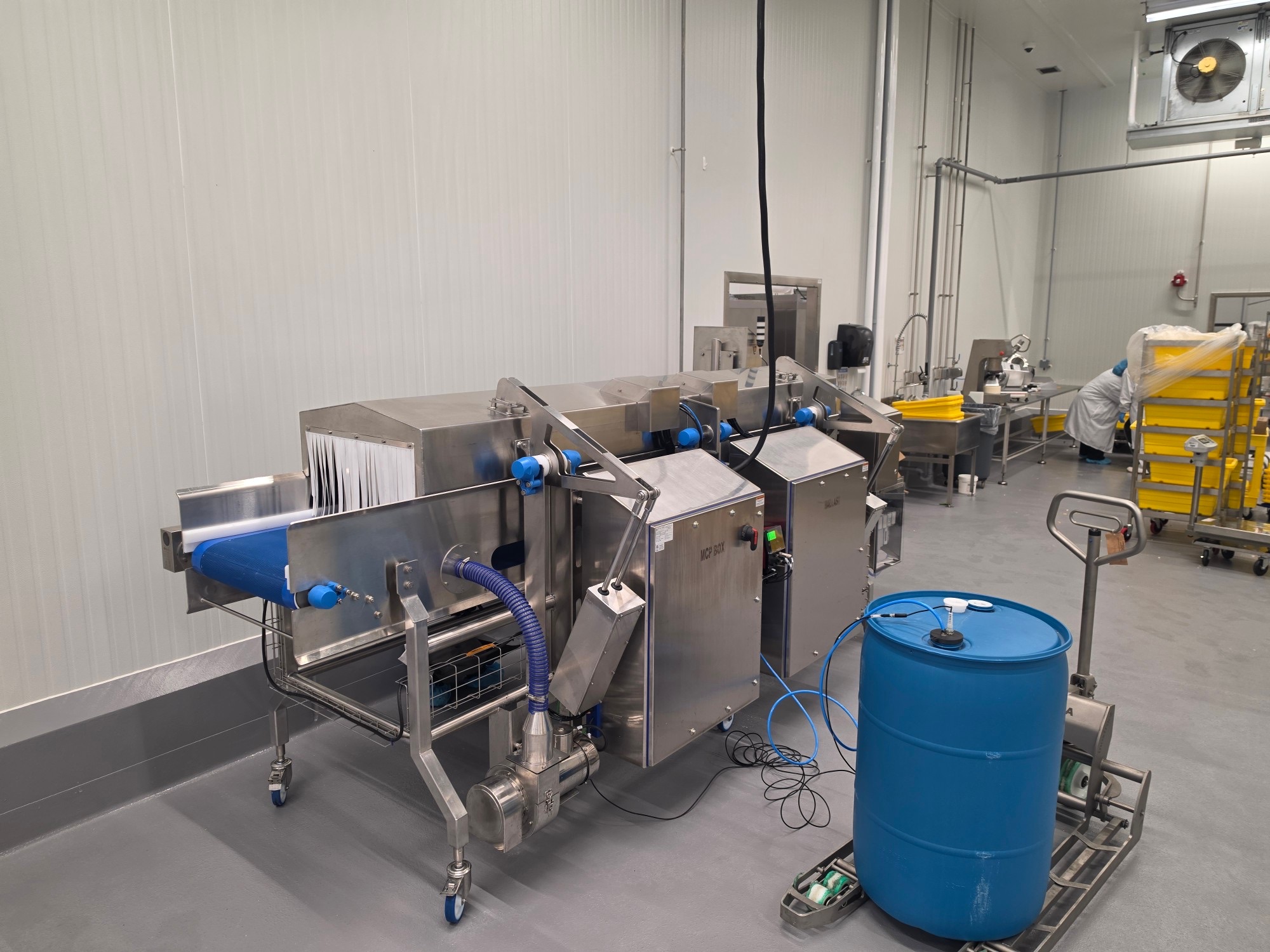 Clean Flow system installed in a commercial processing room beside existing equipment